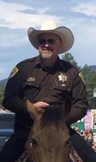 Lewis and Clark County Undersheriff Brent Colbert on a horse